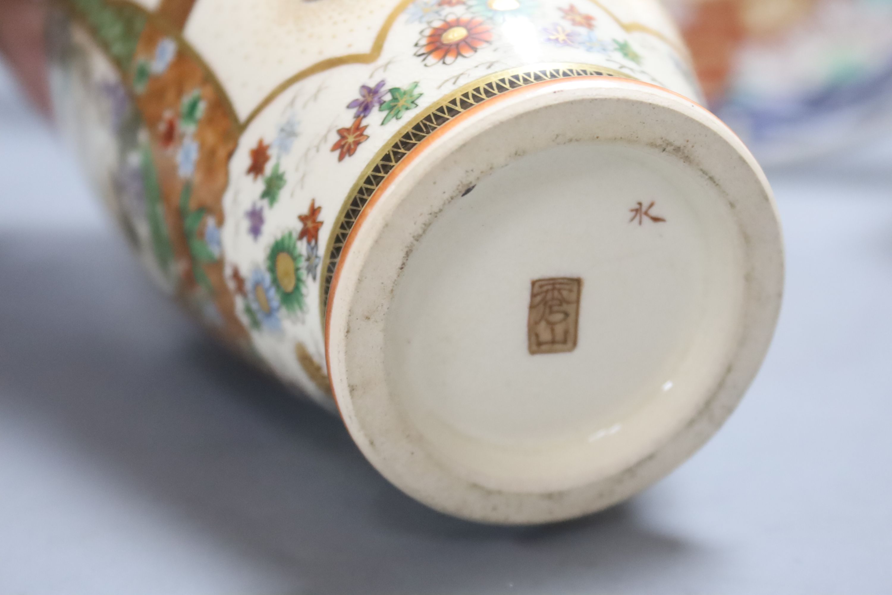 A Japanese Imari charger, a Kutani jar and cover and a Satsuma vase, diameter 40cm